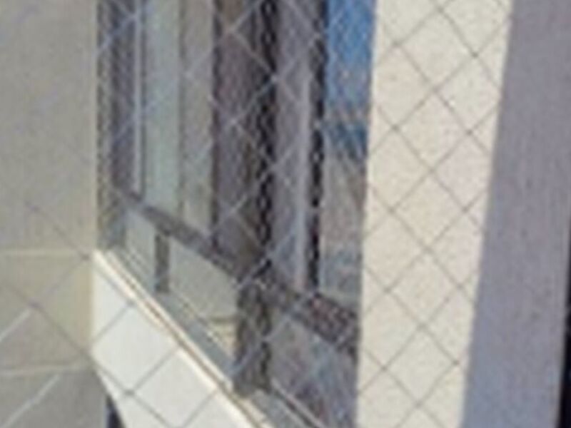 Malla ventana edificio Chile